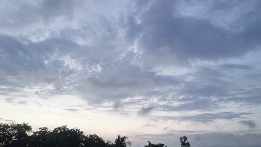 Moving clouds at sunset twilight. Dusk atmosphere. Natural lighting, nature background.