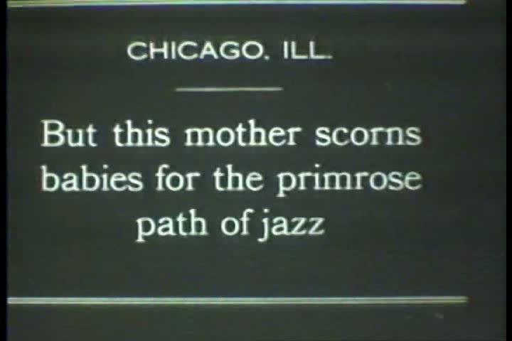 1920s - Black and white footage of a dog playing the piano in the 1920s
