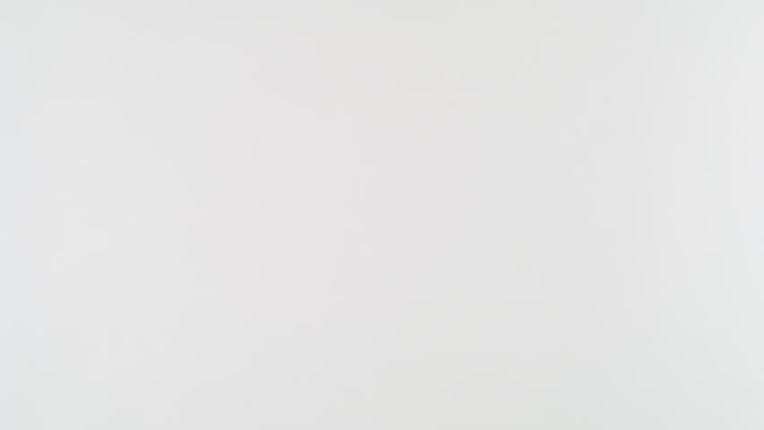 Super Slow Motion Shot of Flying Red Chilli Peppers Isolated on White Background at 1000fps.
