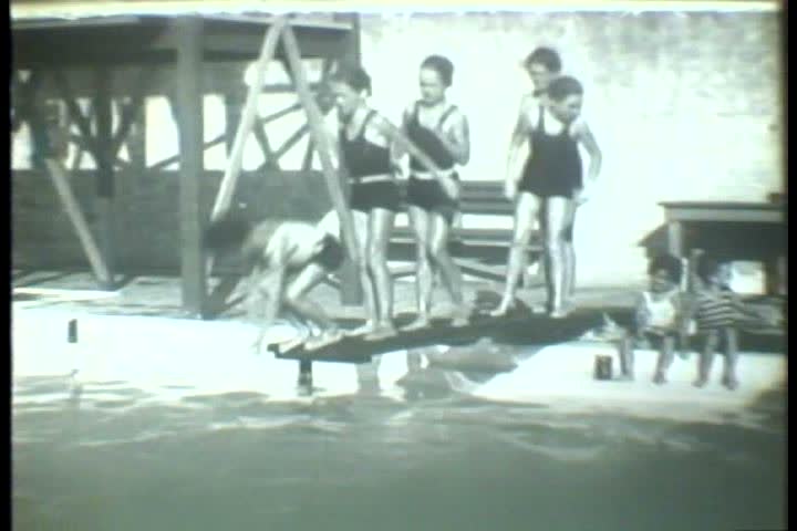 1920s - Black and white footage of a public pool in the 1920s