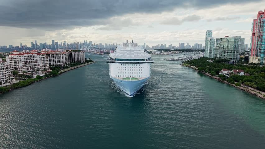 Ship leaving Miami beach port, footage. Cruise ship vacation. Aerial view of cruise ship in vacation summer. Cruise ship vacation and travel at sea. Aerial drone view of luxury liner
