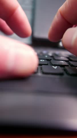 POV: hands typing on a computer keyboard on the table. A laptop keyboard. A wireless keyboard. A dusty keyboard. A dirty computer. Writing, close-up. A writer.