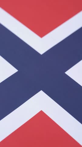 Norwegian national flag in red, blue and white color as a symbol of independence. Flag of Norway