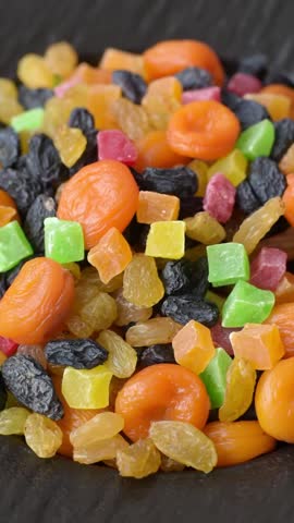 Dried apricots, raisins, and candied fruits as ingredients for baked goods and sweets. Dried fruits