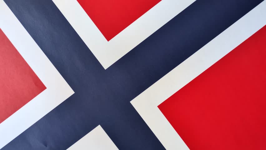 Norwegian national flag in red, blue and white color as a symbol of independence. Flag of Norway