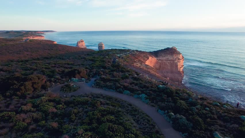 Drone panorama of Twelve Apostles rock formations during golden sunset light