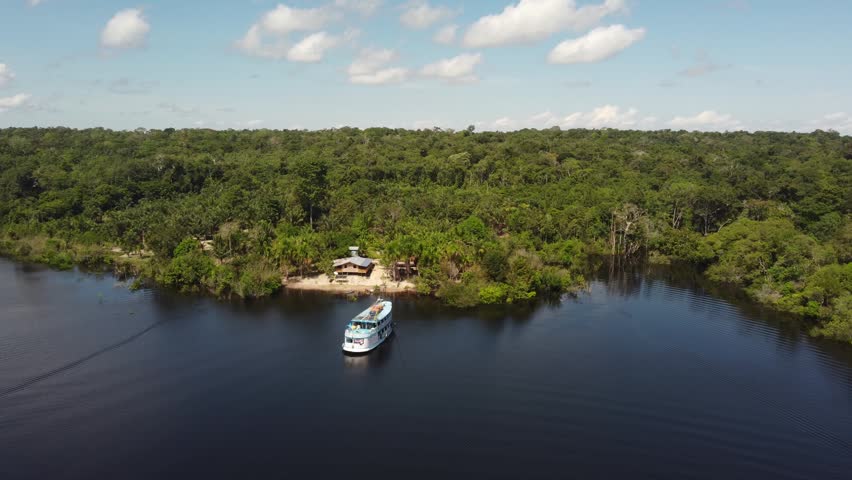 Regional Boat on the Rio Negro Surrounded by the Amazon Rainforest, Brazil