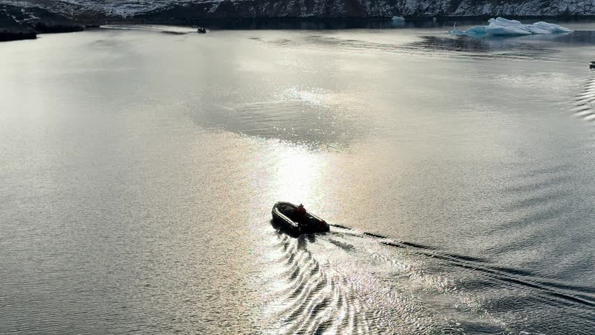 Group of boats exploring icy waters in a remote location