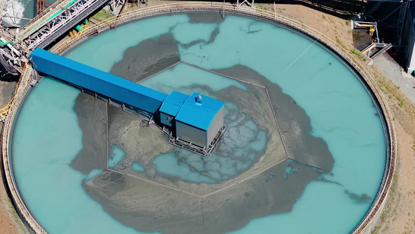 Aerial view manufacturing infrastructure of concentrate factory. Industrial filtration water and treatment facility with sedimentation tanks pulp in gold, copper mining industry.