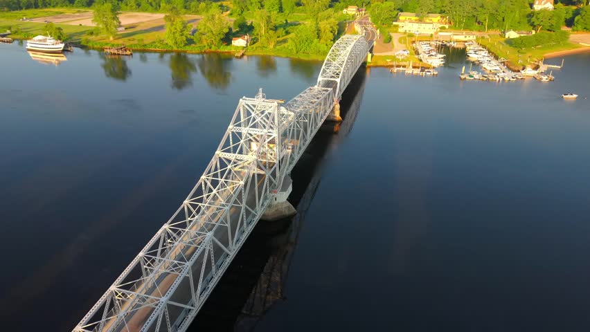 Summer aerial view featuring the East Haddam Swing Bridge along the Connecticut River in East Haddam, Connecticut just after sunrise