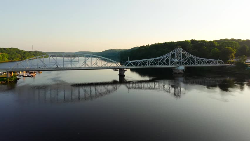 Summer aerial view featuring the East Haddam Swing Bridge along the Connecticut River in East Haddam, Connecticut just after sunrise
