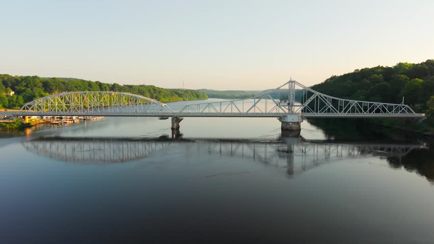 Summer aerial view featuring the East Haddam Swing Bridge along the Connecticut River in East Haddam, Connecticut just after sunrise