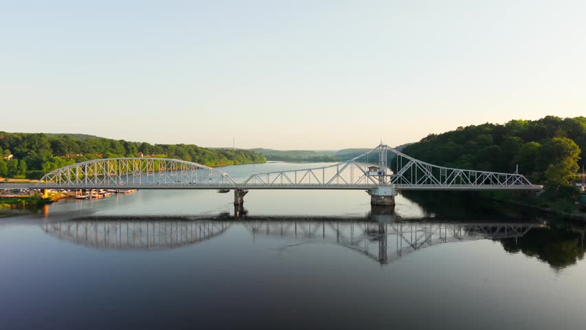 Summer aerial view featuring the East Haddam Swing Bridge along the Connecticut River in East Haddam, Connecticut just after sunrise