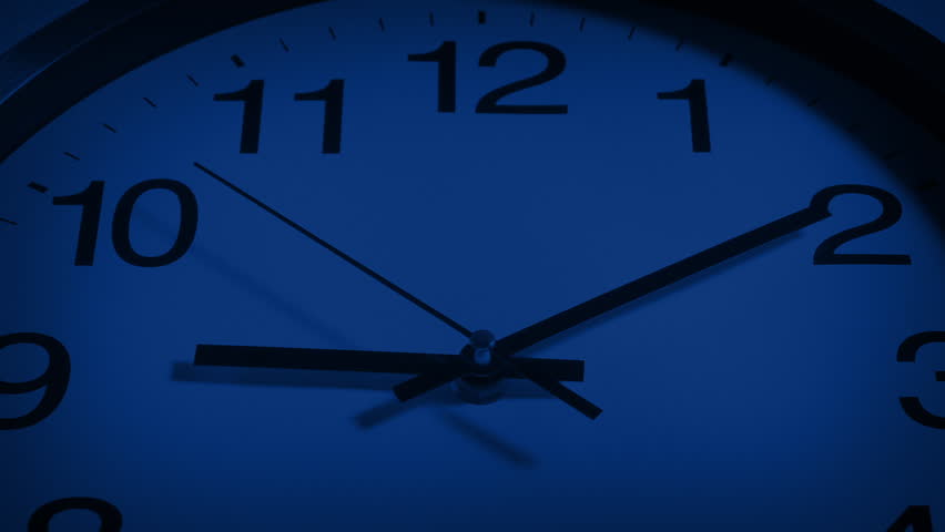 Clock Hands Moving Closeup At Night