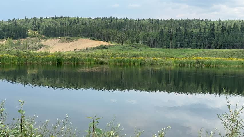 Natural Summer Lake Landscape With Distant Trees, Open Water and a Quiet Rural Atmosphere Near Grande Prairie