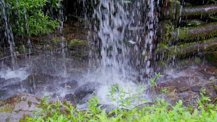 Water flowing at the Mingus Mill in the Great Smoky Mountains National Park in the summer in slow motion.