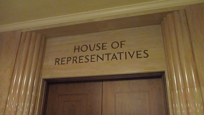 House of Representatives signage above door.