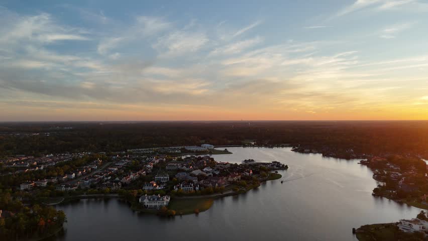 Aerial view of large mansion houses with swimming pool, in affluent neighborhood by Woodlands lake, Houston, Texas, expensive suburban houses by sunset, USA	
