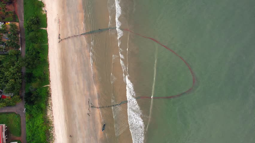 
Malpe, Udupi, Karnataka, India - 20 August 2023
Kairampani, Traditional Shore Seine Fishing, Net Fishing, Beach waves, Padukere Beach, Malpe