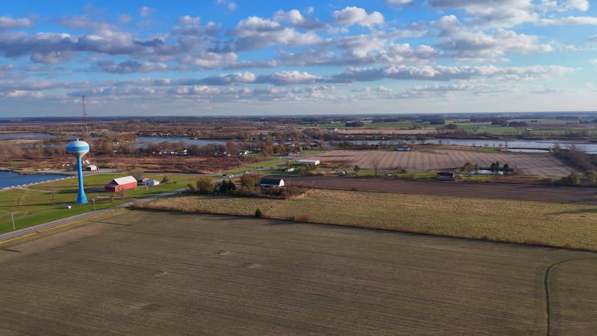 Aerial view of Oak Harbor Ohio with water tower, farmlands, and Portage River