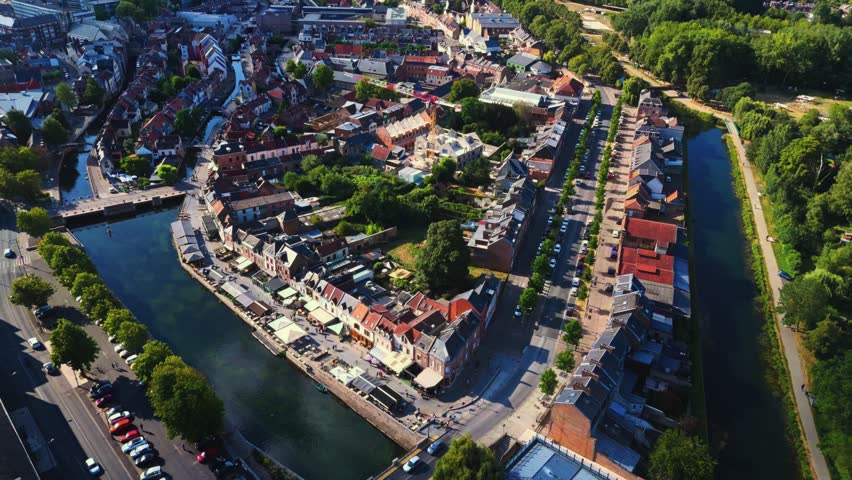 Amiens is a historic northern French city bisected by the Somme River, famous for its floating gardens, brick architecture, vibrant quarters, and rich medieval, industrial, and literary heritage.