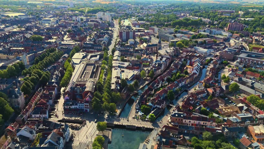 Amiens is a historic northern French city bisected by the Somme River, famous for its floating gardens, brick architecture, vibrant quarters, and rich medieval, industrial, and literary heritage.