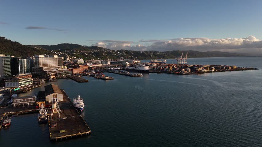 Wide Aerial Shot of Wellington Harbor, Interislander Ferry, and Waterfront at Sunset.