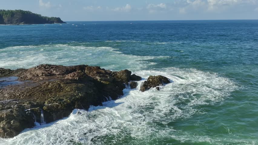 Waves Crashing on Rocky Tropical Shore