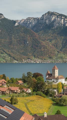 Spiez Switzerland time lapse city skyline at Lake Thun in autumn season (vertical)