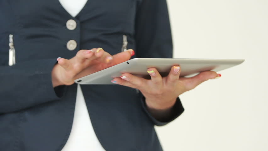 Tablet pc and female hands closeup
