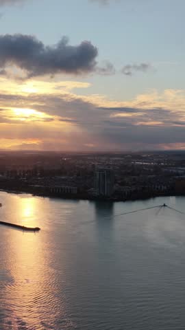 Golden Sunset Over New Westminster Cityscape and Fraser River in British Columbia, Canada