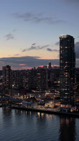 New Westminster Cityscape at Dusk: Aerial View of High-Rise Buildings and Waterfront in British Columbia