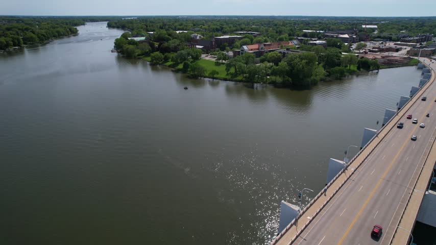 Over bridge Aerial of De Pere Wisconsin on the Fox River in Summer time