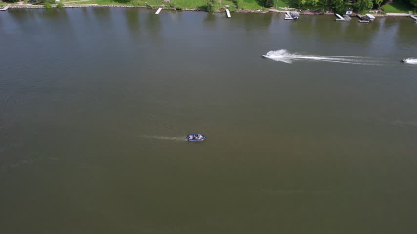 Boat Follow Aerial of De Pere Wisconsin on the Fox River in Summer time