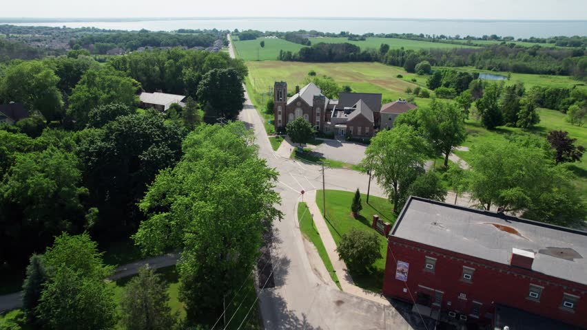 Rise and Fall shot Rural Church Aerial in Green Bay Wisconsin on Bay Settlement Road in summertime