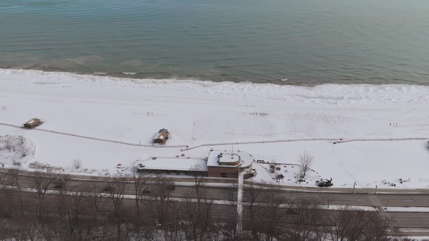 Left to right Bradford beach Aerial Milwaukee Wisconsin in Winter at the historic water pump station and tower