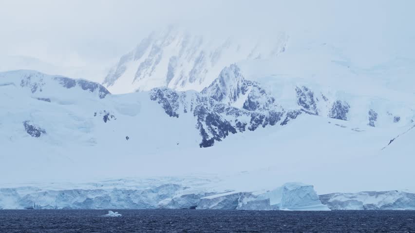 Glacier and Mountains on Coast, Antarctica Mountain Landscape of Coastal Scenery, Blue Winter Scene with Ice and Ocean Sea Water, Antarctic Peninsula Seascape in Beautiful Dramatic Scene