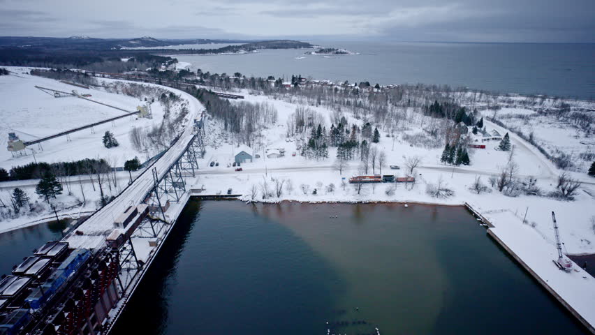 Drone shot looking over Marquette Michigan and lake superior