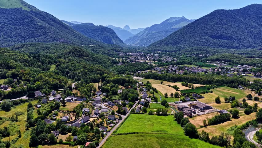Pyrenees mountain village and lush green valley near Col d