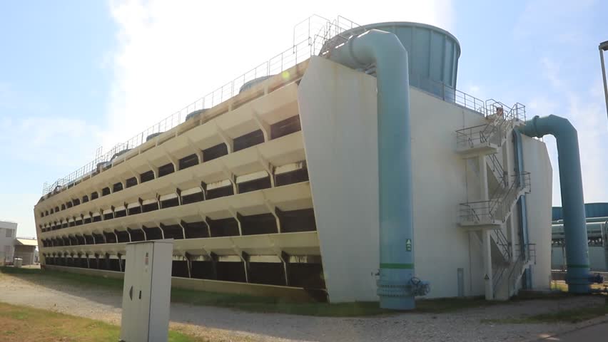 Large cooling tower at Krsko Nuclear Power Plant in Slovenia with visible steam plume, archival footage representing nuclear energy production during hot and dry summer conditions near the Sava River