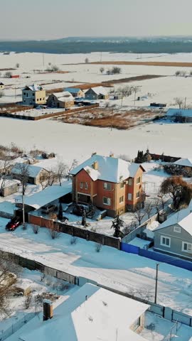 Winter, snow-covered streets, houses. frosty sunny day. aero, view from above.