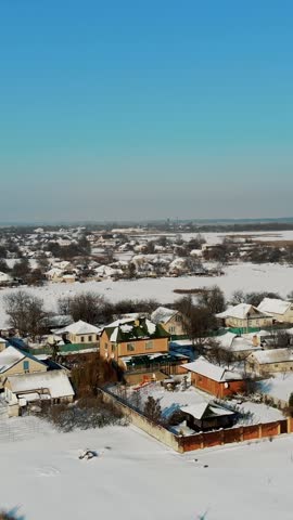 Winter, snow-covered streets, houses. frosty sunny day. aero, view from above.
