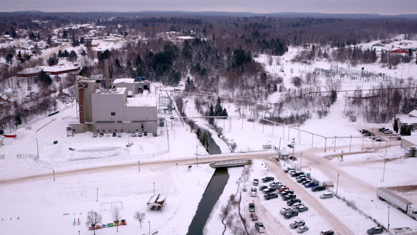 Drone footage flying above a peaceful Lake Superior town in Michigan