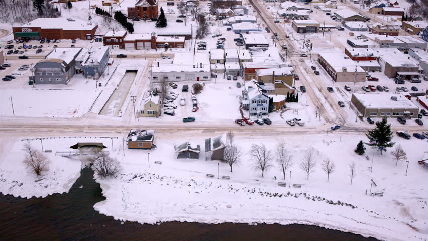 Aerial view of a quiet Upper Peninsula town nestled beside Lake Superior.