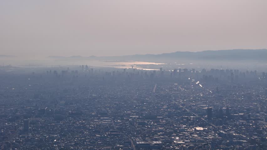 Osaka cityscape from far, drone view