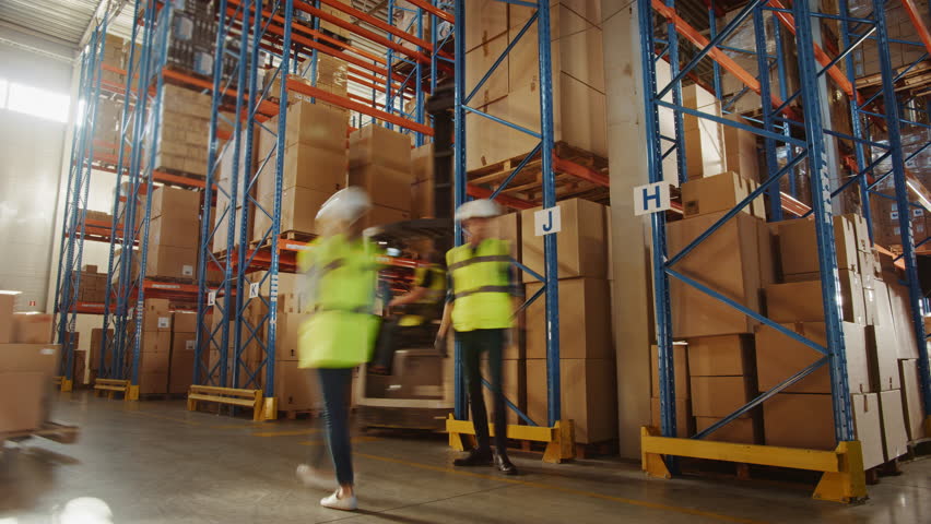 Time-lapse: E-commerce Retail Warehouse Distribution Center Full of Shelves With Goods in Cardboard Boxes, Diverse Workers Carry Packages, Move Inventory With Forklifts, Prepare Online Shopping Orders