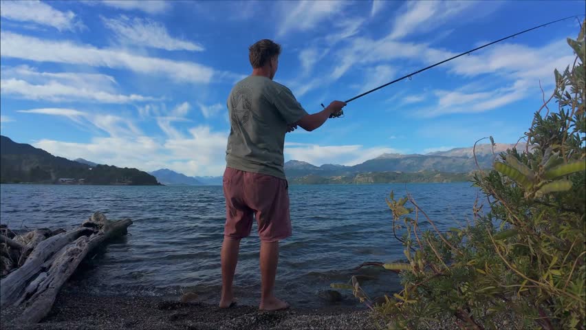 Man Fishing On Lago General Carrera Along Carretera Austral In Patagonia Chile