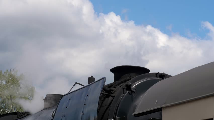 BEEKBERGEN, NETHERLANDS - AUGUST 2026: Detail View of Steam Vapour Released from Locomotive