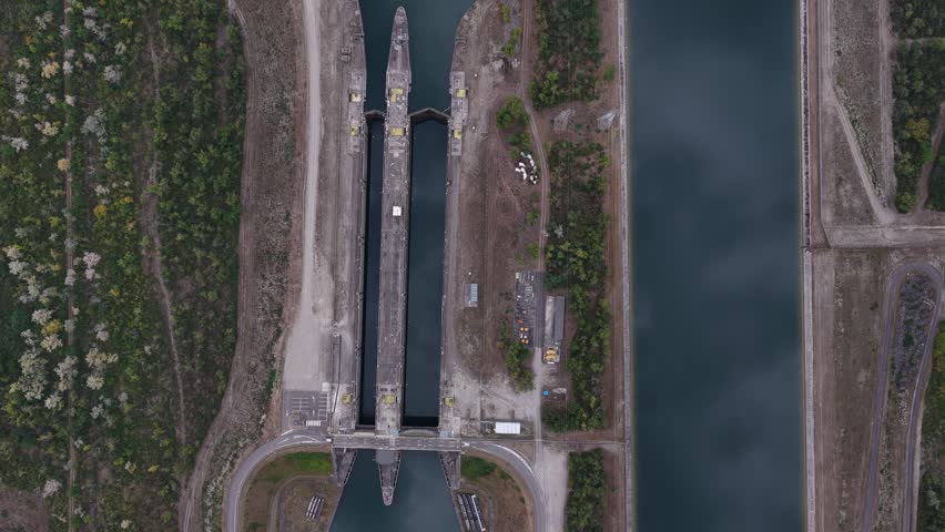 Aerial view of the CNPE de Fessenheim canal lock system showing concrete structures and waterways in Fessenheim, Grand Est, France.