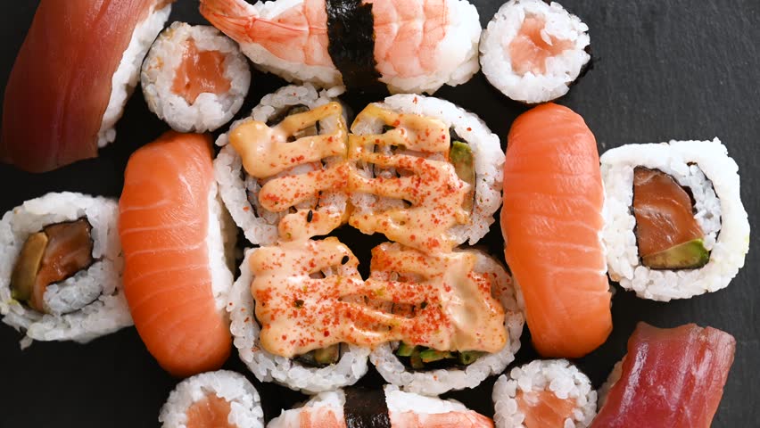Assorted Sushi Platter Rotating background. Top view